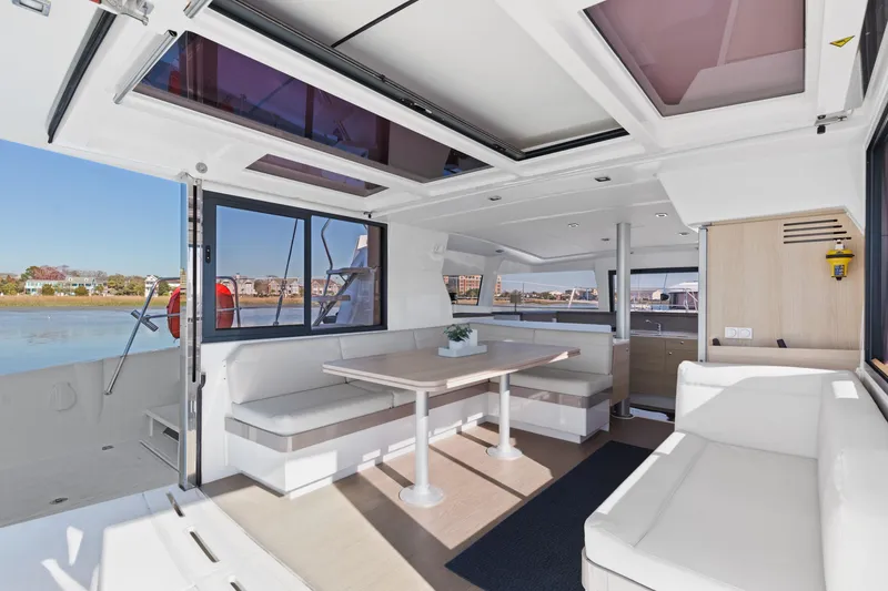 Slide: The Image of Spacious interior of 2018 Bali 4.0 catamaran with modern seating and dining area. - 10