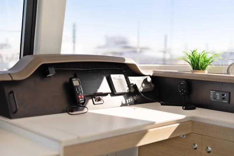 Slide: The Image of Modern navigation station on 2018 Bali 4.0 yacht with communication devices and plant. - 15