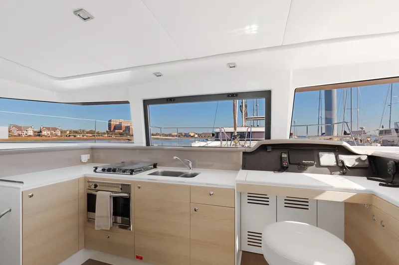 Slide: The Image of Modern kitchen interior on 2018 Bali 4.0 catamaran with marina view. - 16