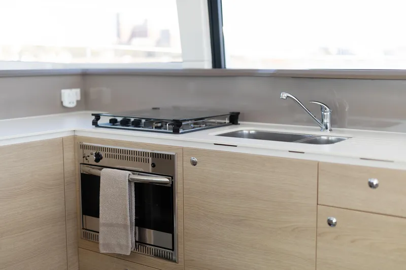 Slide: The Image of Modern kitchen in 2018 Bali 4.0 yacht with stove, oven, and sink. - 17