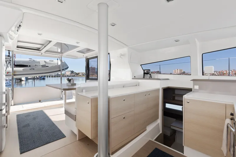 Slide: The Image of Interior of 2018 Bali 4.0 catamaran with modern kitchen and marina view. - 19