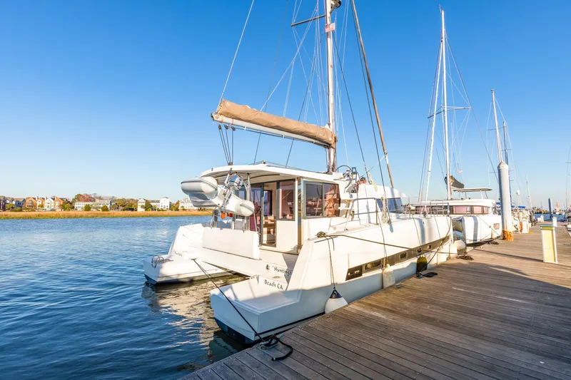 Slide: The Image of 2018 Bali 4.0 catamaran docked at a marina under clear blue skies. - 2