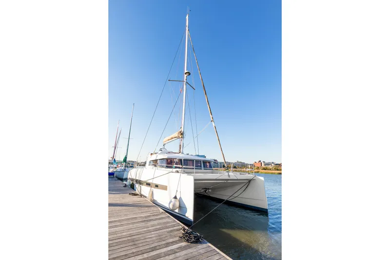 Slide: The Image of 2018 Bali 4.0 catamaran docked at a marina under clear blue skies. - 3