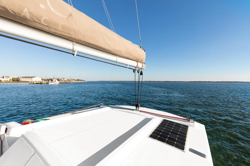 Slide: The Image of Sailing on a 2018 Bali 4.0 catamaran with solar panel, clear blue sky, and ocean view. - 37