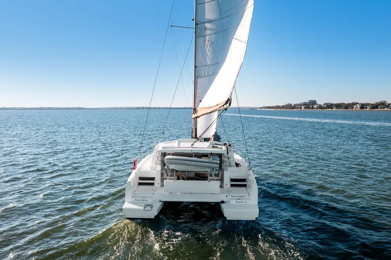 Slide: The Image of Sailing catamaran Bali 4.0, 2018 model, cruising on open water under clear blue sky. - 38