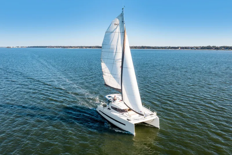 Slide: The Image of Sailing catamaran Bali 4.0, 2018 model, cruising on open water under clear blue skies. - 39