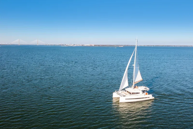 Slide: The Image of Sailing catamaran Bali 4.0, 2018 model, on open sea with clear blue sky. - 40
