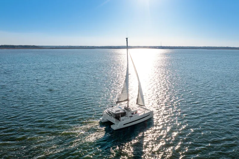 Slide: The Image of Sailing catamaran Bali 4.0 (2018) on open water under clear blue sky. - 43
