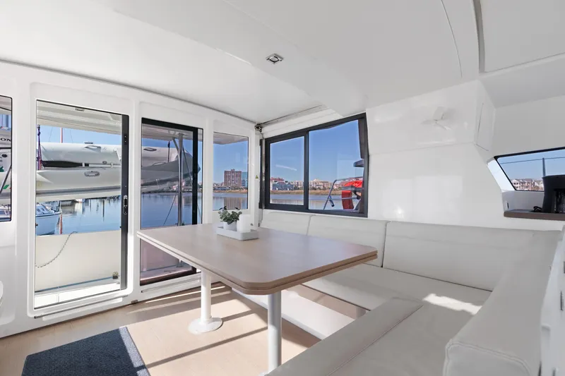 Slide: The Image of Interior of 2018 Bali 4.0 catamaran with spacious seating and waterfront view. - 7