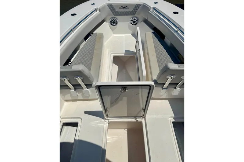 Slide: The Image of 2020 Invincible 36 Open Fisherman boat interior with seating and storage compartments. - 13