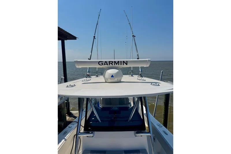 Slide: The Image of 2020 Invincible 36 Open Fisherman boat with Garmin equipment, docked by the sea. - 15