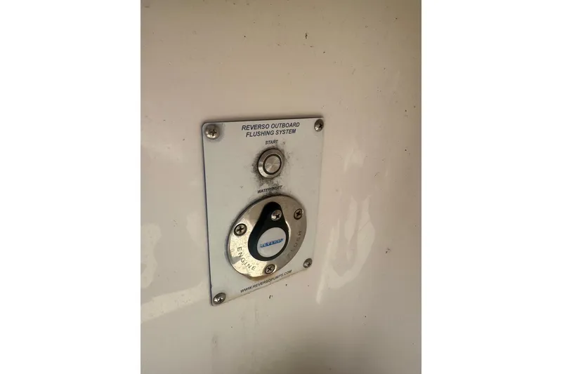 Slide: The Image of Reverso outboard flushing system on 2020 Invincible 36 Open Fisherman boat. - 17