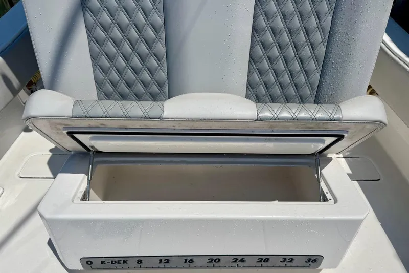 Slide: The Image of Open storage compartment on 2020 Invincible 36 Open Fisherman boat with cushioned seating. - 22