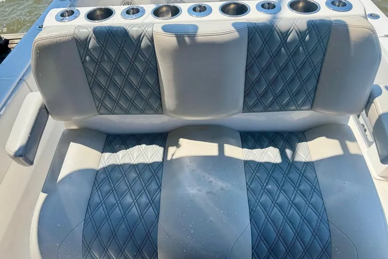 Slide: The Image of Luxurious seating on 2020 Invincible 36 Open Fisherman boat with cup holders. - 24