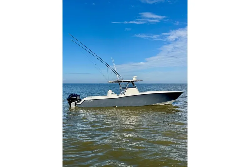 Slide: The Image of 2020 Invincible 36 Open Fisherman boat on calm ocean waters under blue sky. - 3