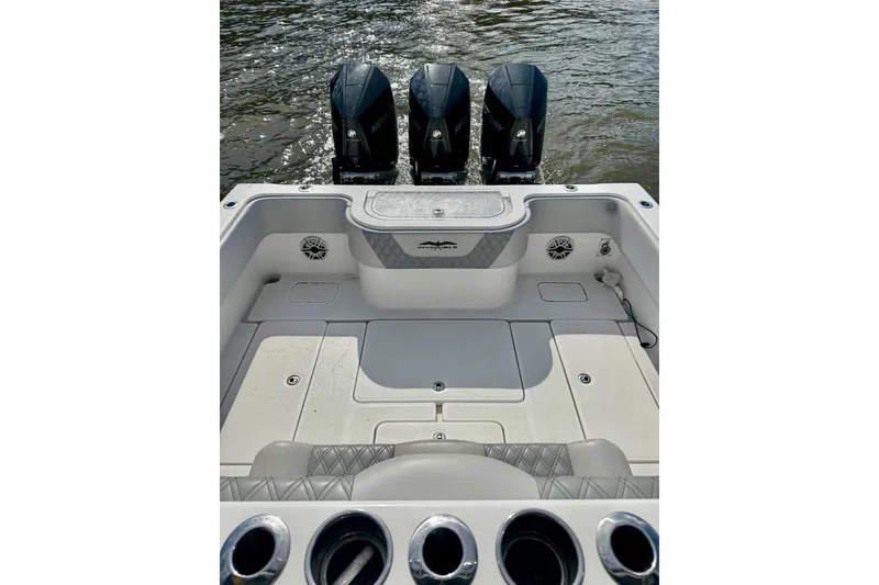 Slide: The Image of 2020 Invincible 36 Open Fisherman boat with triple outboard motors on water. - 5