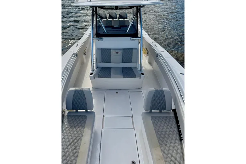 Slide: The Image of 2020 Invincible 36 Open Fisherman boat interior with cushioned seating and open deck. - 9