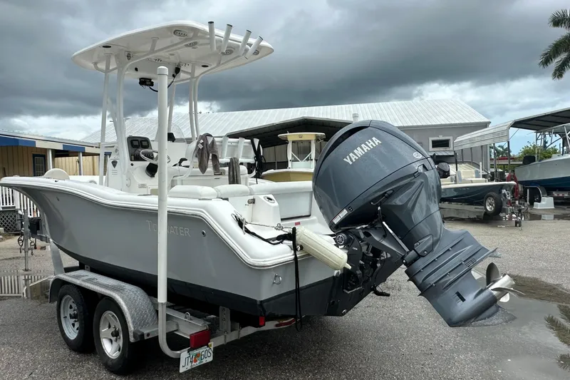Slide: The Image of 2014 Tidewater 210 CC Adventure boat with Yamaha engine on trailer. - 2