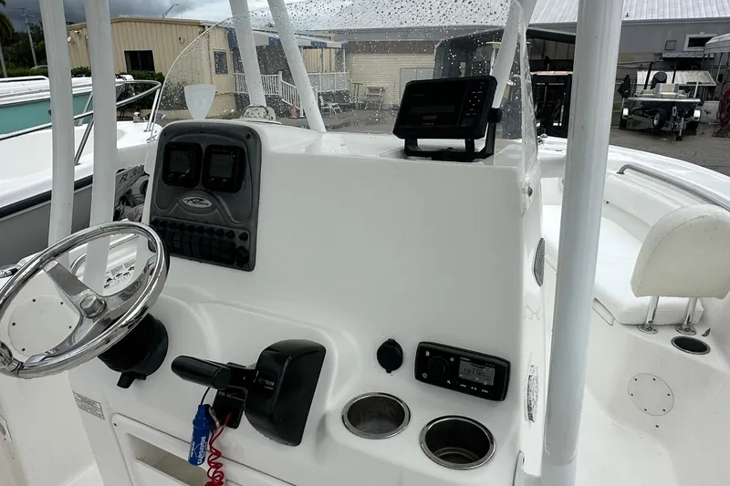 Slide: The Image of 2014 Tidewater 210 CC Adventure boat console with steering wheel and navigation equipment. - 3