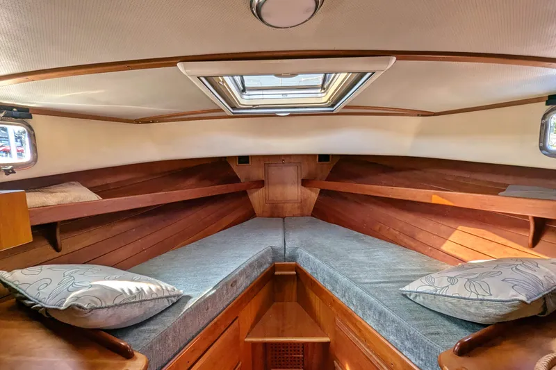 Slide: The Image of Cozy cabin interior of 2000 Duffy Flybridge 37 with wooden finish and skylight. - 14