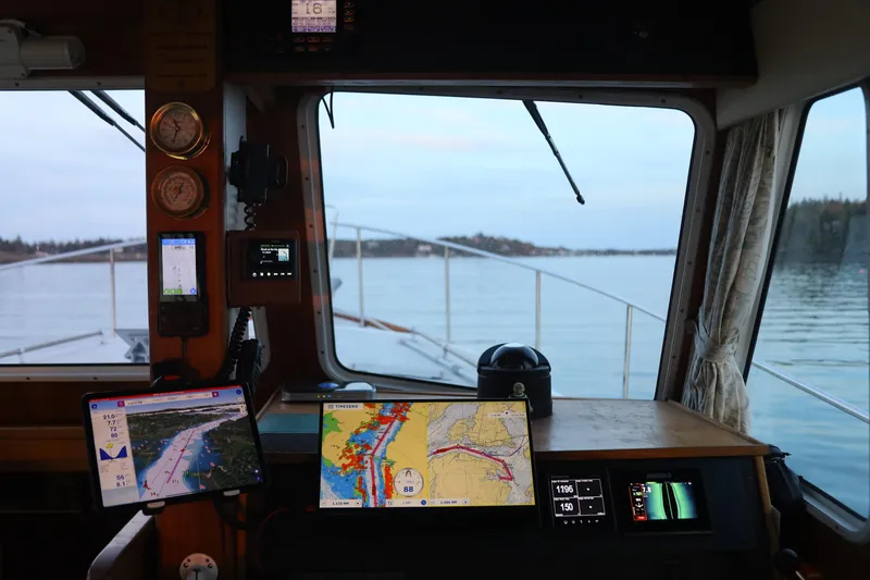 Slide: The Image of Interior view of 2000 Duffy Flybridge 37 boat with navigation equipment and sea view. - 16