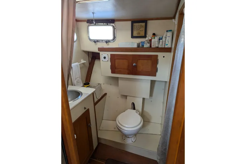 Slide: The Image of Bathroom interior of 2000 Duffy Flybridge 37 boat with sink and toilet. - 18