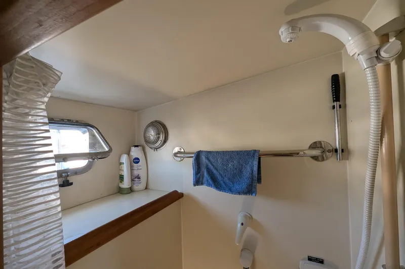 Slide: The Image of Bathroom interior of 2000 Duffy Flybridge 37 yacht with shower and window. - 20