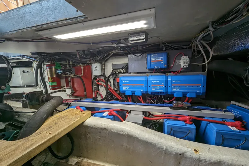 Slide: The Image of Engine room of a 2000 Duffy Flybridge 37 with electrical equipment and wiring. - 22