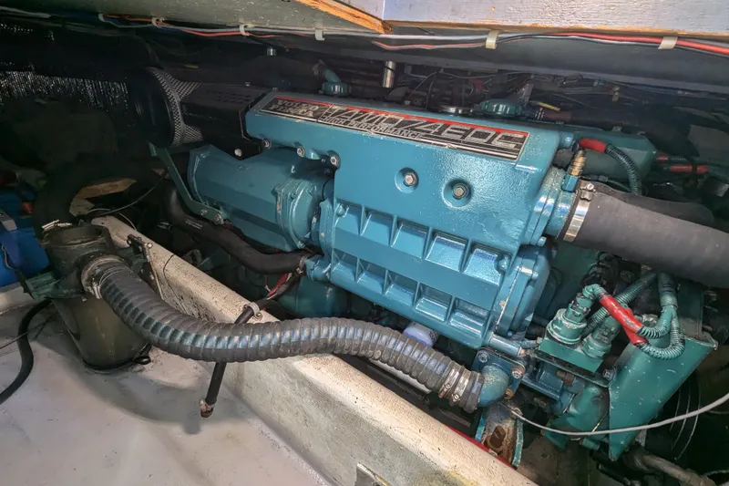 Slide: The Image of Engine compartment of a 2000 Duffy Flybridge 37 boat, showcasing detailed machinery. - 23