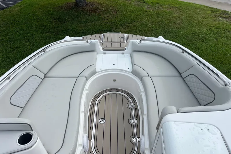 Slide: The Image of 2022 Citation 240 boat interior with cushioned seating and wood-style flooring. - 10