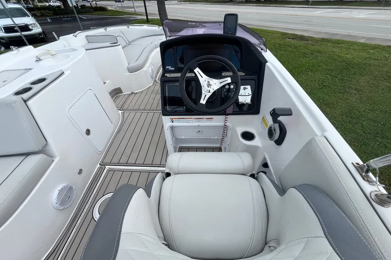 Slide: The Image of Interior view of a 2022 Citation 240 boat, featuring a sleek steering console. - 12