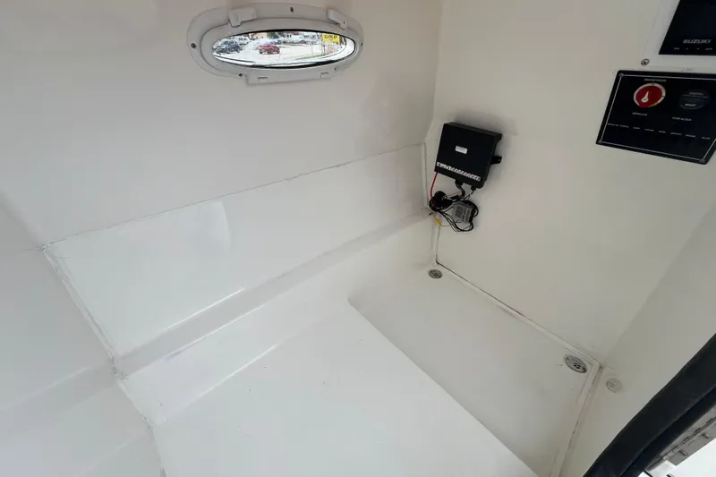 Slide: The Image of Interior of a 2022 Citation 240 boat, featuring a clean, white cabin space. - 15