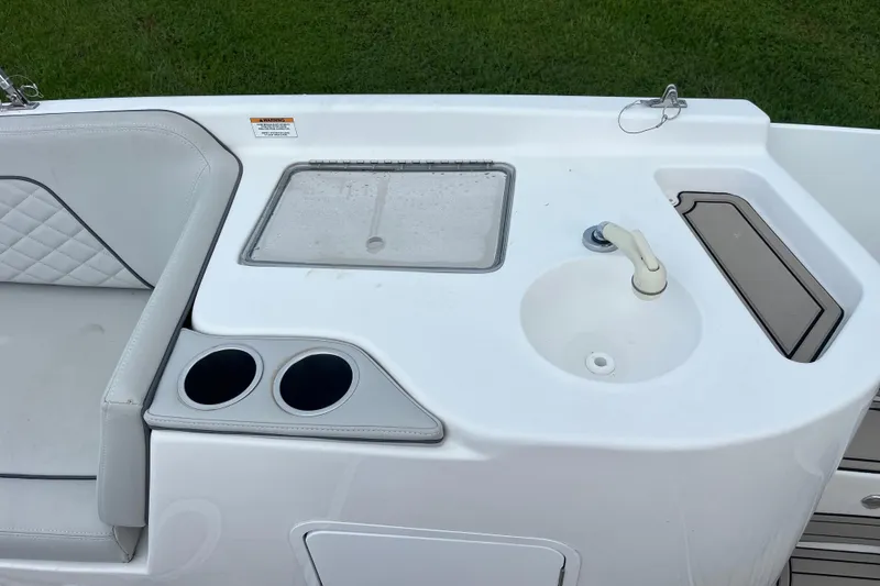 Slide: The Image of Citation 240 boat interior with sink, cup holders, and seating, 2022 model. - 18