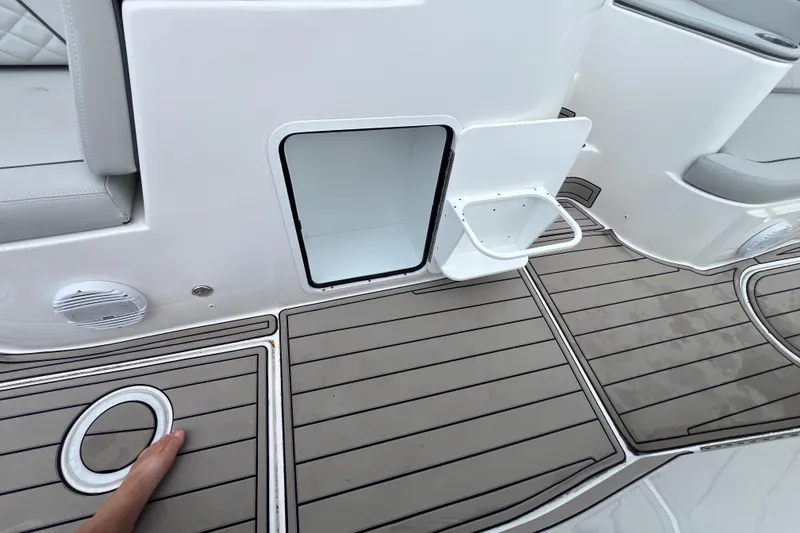 Slide: The Image of 2022 Citation 240 boat interior with open storage compartment and sleek flooring design. - 20