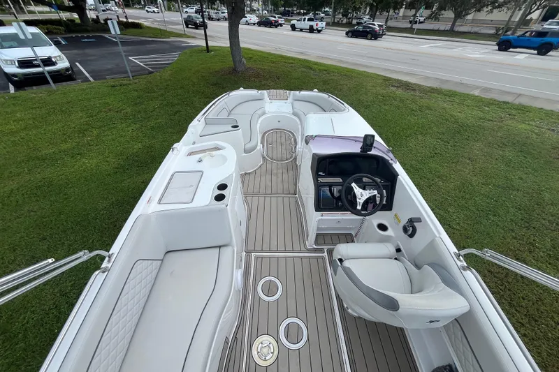 Slide: The Image of 2022 Citation 240 boat interior with seating, steering wheel, and deck view. - 8