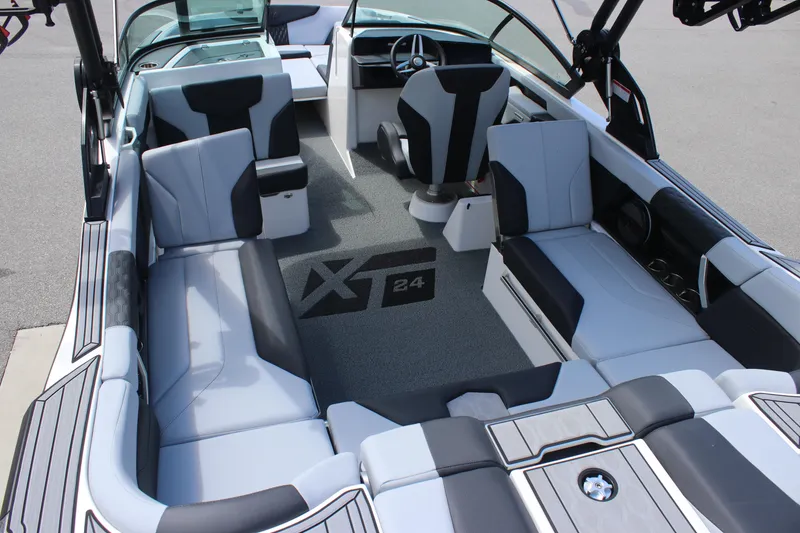 Slide: The Image of 2025 MasterCraft XT24 boat interior with sleek seating and modern design. - 10