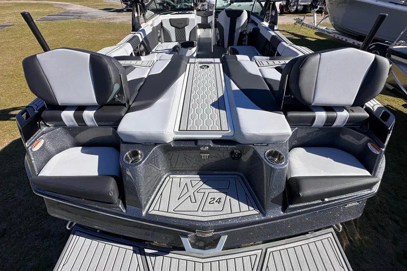 Slide: The Image of 2025 MasterCraft XT24 boat interior with sleek seating and modern design. - 17