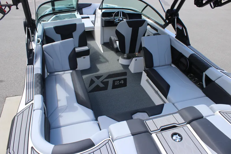 Slide: The Image of 2025 MasterCraft XT24 boat interior with modern seating and sleek design. - 9