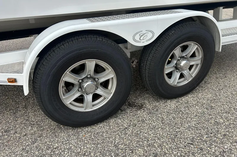 Slide: The Image of Trailer wheels of a 2010 Cobalt 276 on a textured pavement. - 10