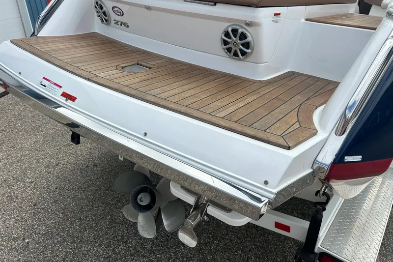 Slide: The Image of Rear view of 2010 Cobalt 276 boat with teak swim platform and dual propellers. - 12
