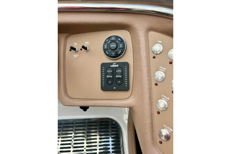 Slide: The Image of Control panel of a 2010 Cobalt 276 boat with switches and buttons. - 18