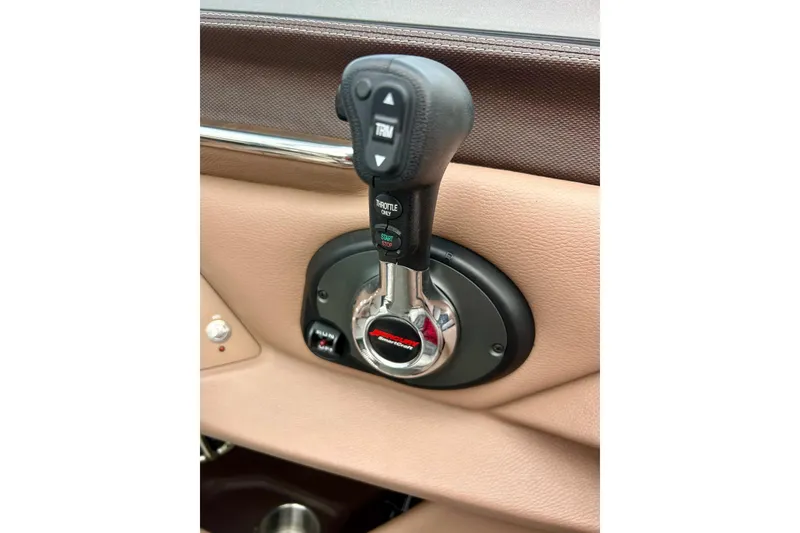 Slide: The Image of Throttle control lever in a 2010 Cobalt 276 boat interior. - 20