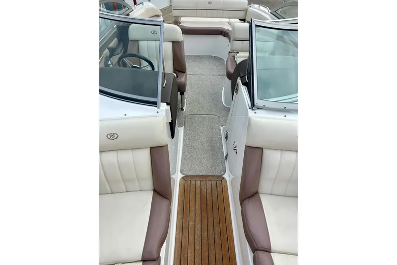 Slide: The Image of Interior view of a 2010 Cobalt 276 boat with leather seating and wood flooring. - 22