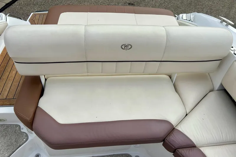 Slide: The Image of Cobalt 276 boat interior seating, 2010 model, featuring cream and brown upholstery. - 29