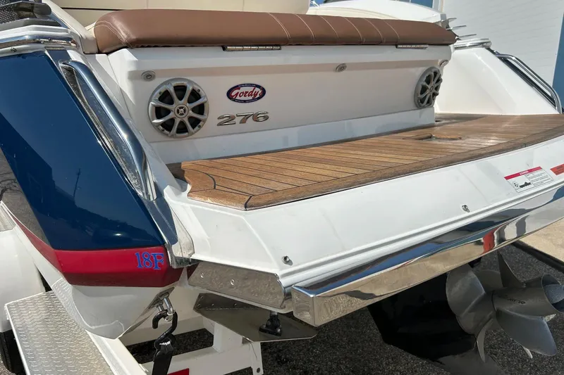 Slide: The Image of 2010 Cobalt 276 boat stern with teak deck and speakers. - 40