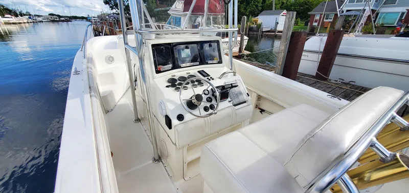 Slide: The Image of 1996 Fountain 31 Tournament Edition boat interior with steering wheel and control panel. - 15