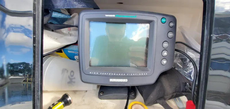 Slide: The Image of 1996 Fountain 31 Tournament Edition boat dashboard with navigation and communication equipment. - 20