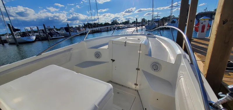 Slide: The Image of 1996 Fountain 31 Tournament Edition boat deck with stainless steel railings and white interior. - 25