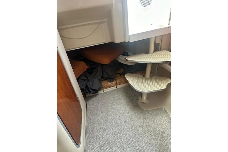 Slide: The Image of Interior view of 2010 Wellcraft 290 Coastal Walk-Around boat with steps and storage area. - 16