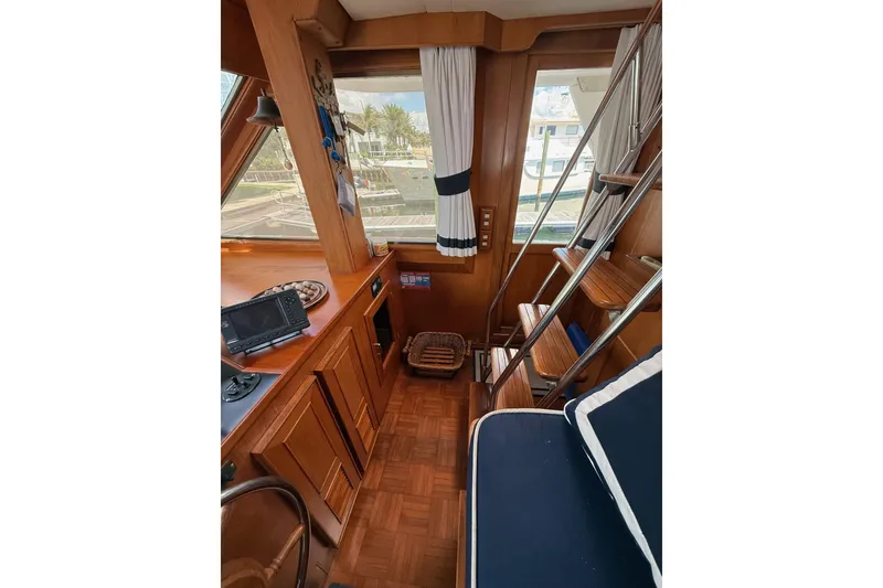 Slide: The Image of Interior of 1989 Jefferson Marquessa 52 yacht with wooden finishes and nautical decor. - 11